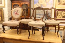 Set of three Victorian walnut balloon back parlour chairs and similar nursing chair.