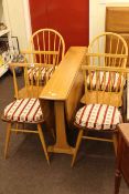 Slim Ercol drop leaf dining table and six chairs (4x2).