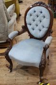 Victorian carved mahogany oval panel back open armchair.