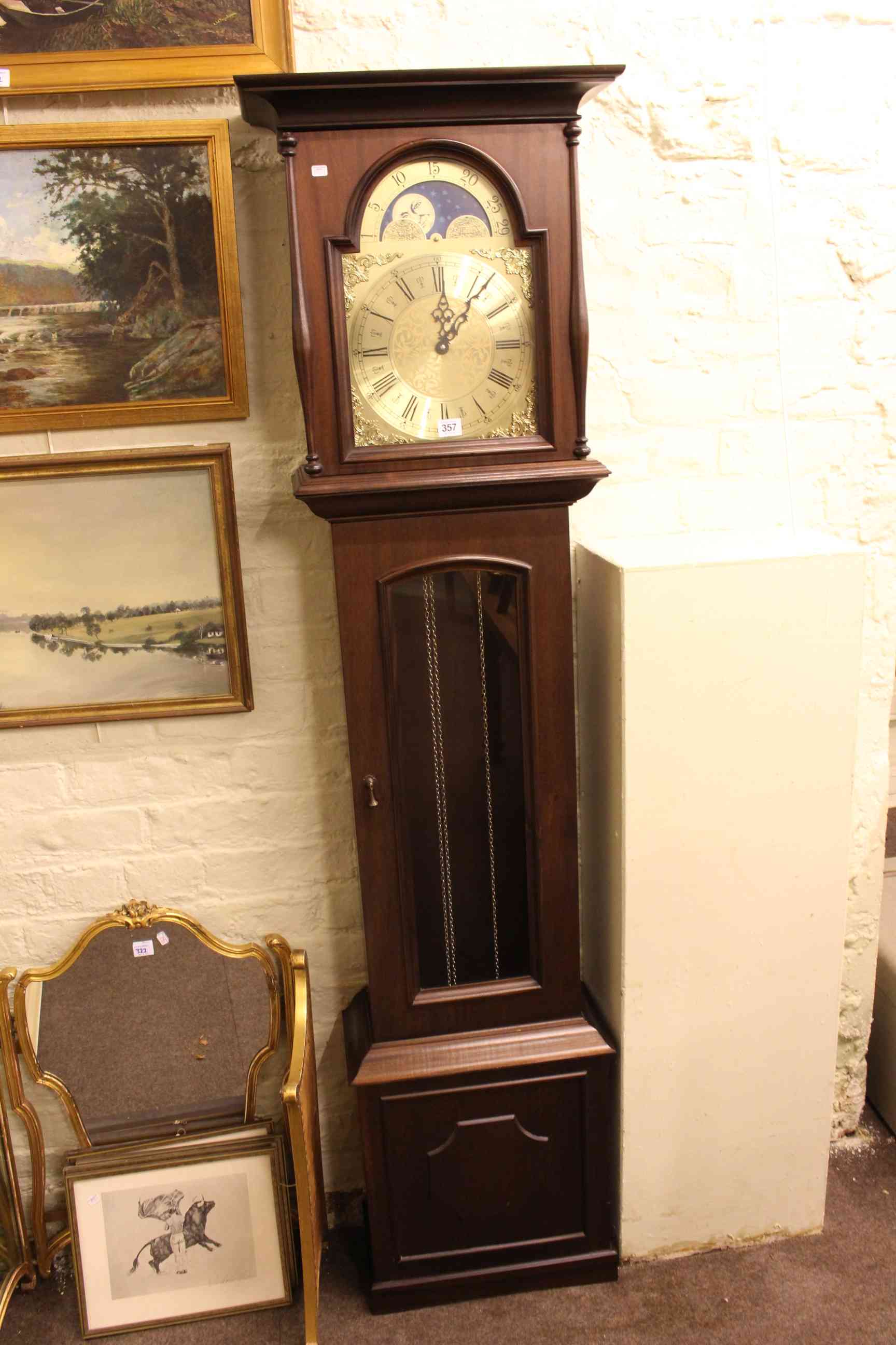 Modern triple weight longcase clock having moon-phase dial, 187cm by 48cm.