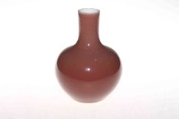 Chinese pink brown glazed bottle neck vase, seal mark to base, 18.5cm.