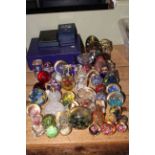Pair of Edinburgh Crystal wine glasses and collection of assorted glass paperweights.