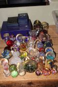 Pair of Edinburgh Crystal wine glasses and collection of assorted glass paperweights.