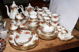 Royal Albert Country Roses table service with six plate settings plus coffee and teapot, mugs,