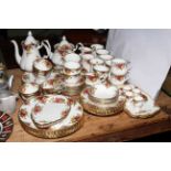 Royal Albert Country Roses table service with six plate settings plus coffee and teapot, mugs,