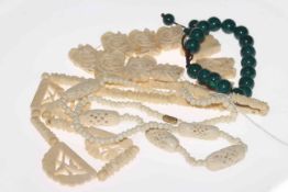 Two vintage ivory/bone necklaces and panel bracelet, and green bead bracelet (4).