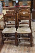 Set of six rush seated ladder back Country chairs.