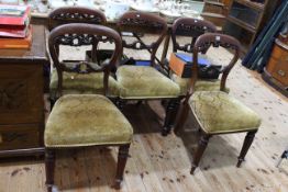 Set of five Victorian mahogany carved balloon back dining chairs.