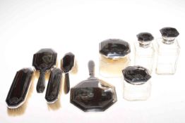 Silver plate mounted nine piece dressing table set, complete with four toilet bottles.