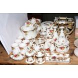 Collection of Royal Albert Country Roses pieces including two telephones, planters, vases,