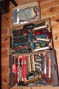 Three boxes of Hornby Dublo trains, carriages, trucks, buildings and spares.