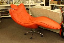 Contemporary red leather swivel lounger.