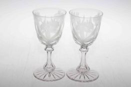 Pair flower etched glass goblets.