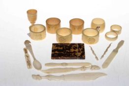 Collection of vintage ivory napkin rings, some carved, bone letter openers,