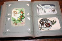 Large old postcard album of old Christmas and New Year postcards, approximately 290 cards.