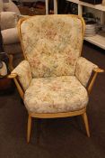 Ercol armchair in buttoned tapestry fabric.
