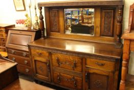 Carved oak mirror back sideboard and Edwardian mahogany three drawer bureau.