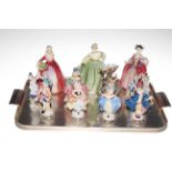 Collection of eleven figurines including three Royal Doulton.