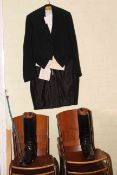 Frocked coat and waistcoat, and a pair of riding boots.