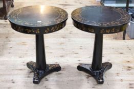 Pair circular black lacquered and leaf decorated pedestal tables on triform bases,