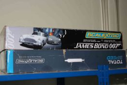 Scalextric James Bond 007 and Scalextric Total Speed Racing Car, boxed sets.