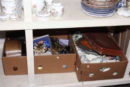 Two boxes of ceramics, mantel clocks, Wade Whimsies, cased cutlery.