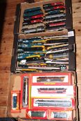 Three boxes of assorted model railway locomotives and carriages.