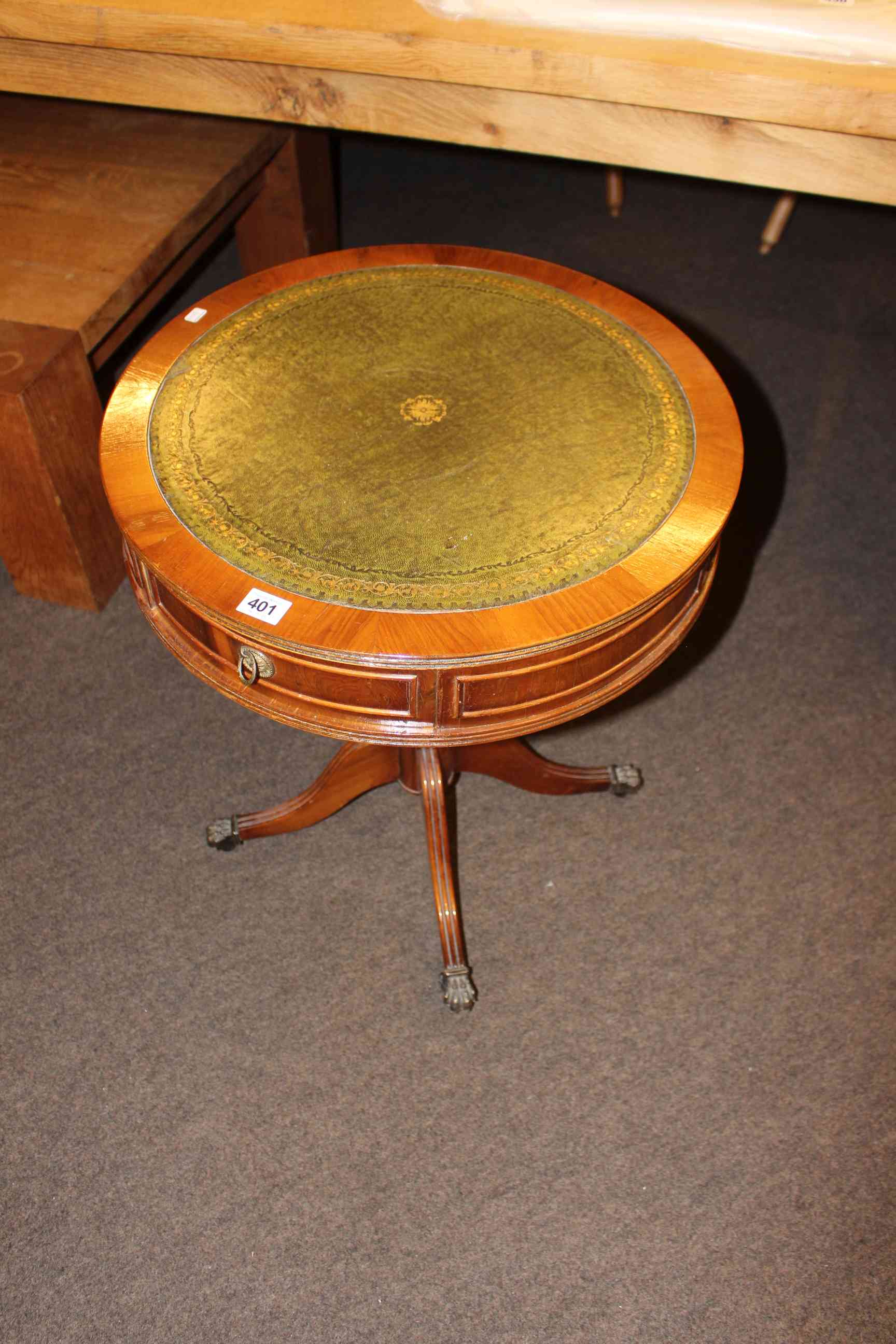 Yew two drawer drum table with inset leather top, 60cm by 50cm diameter.