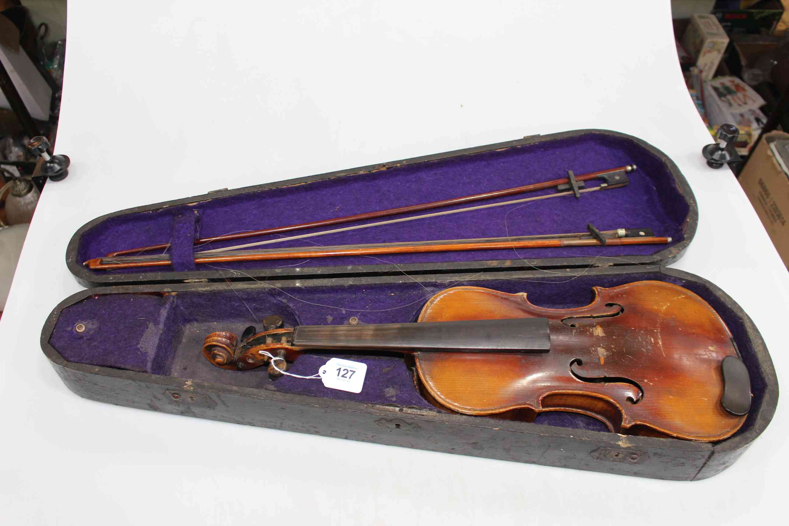 Violin and two bows, cased, by Stainer, impressed on back.