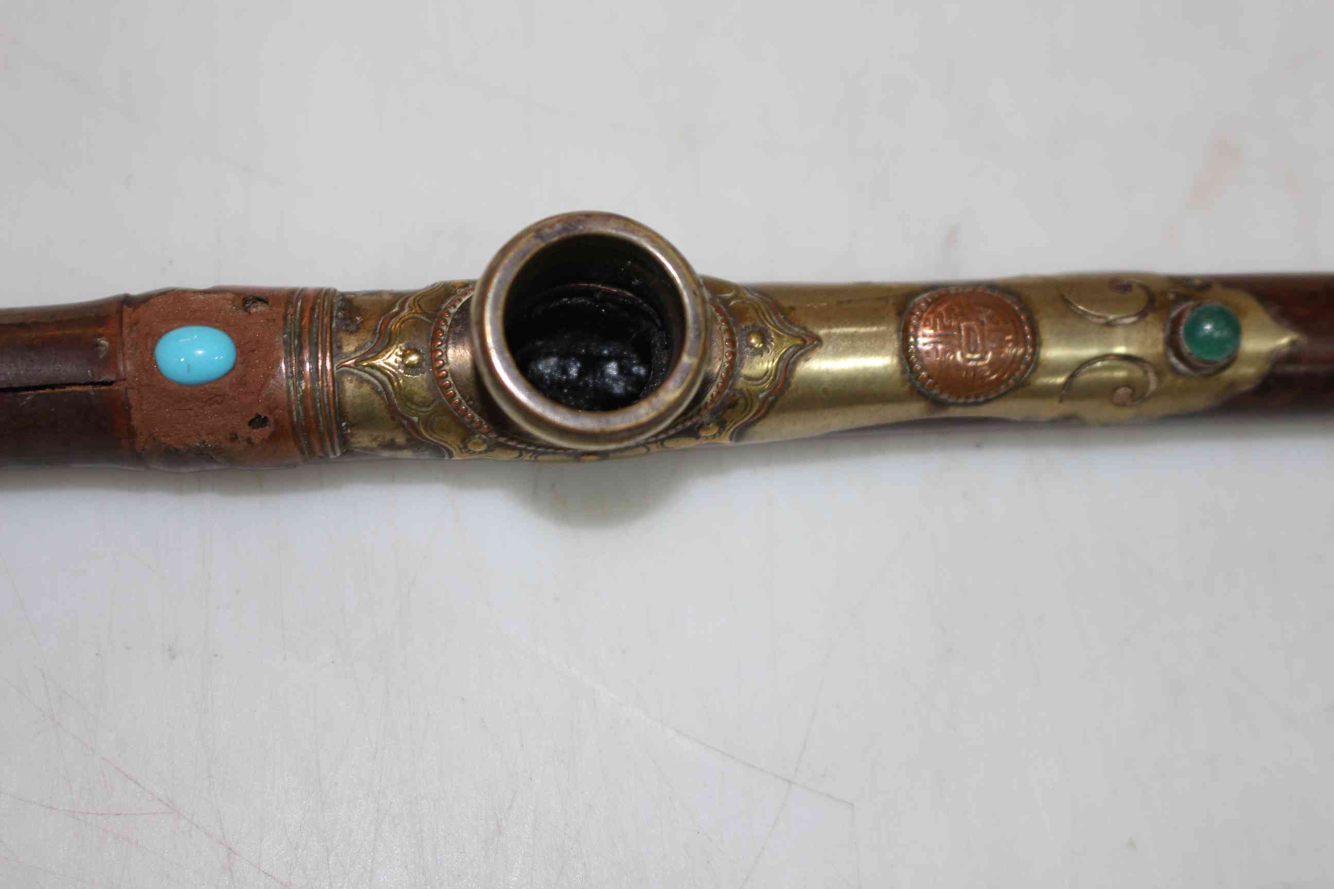 Opium pipe with jewelled brass mount, 48cm length. - Image 2 of 2