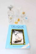 Collection of nine Lalique, Dior, Swarovski, etc perfume bottles, and a book on Lalique Collecting.