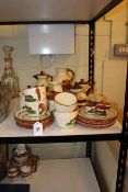 Collection of Torquay Mottoware pottery including teapots, jugs, cups and saucers etc.