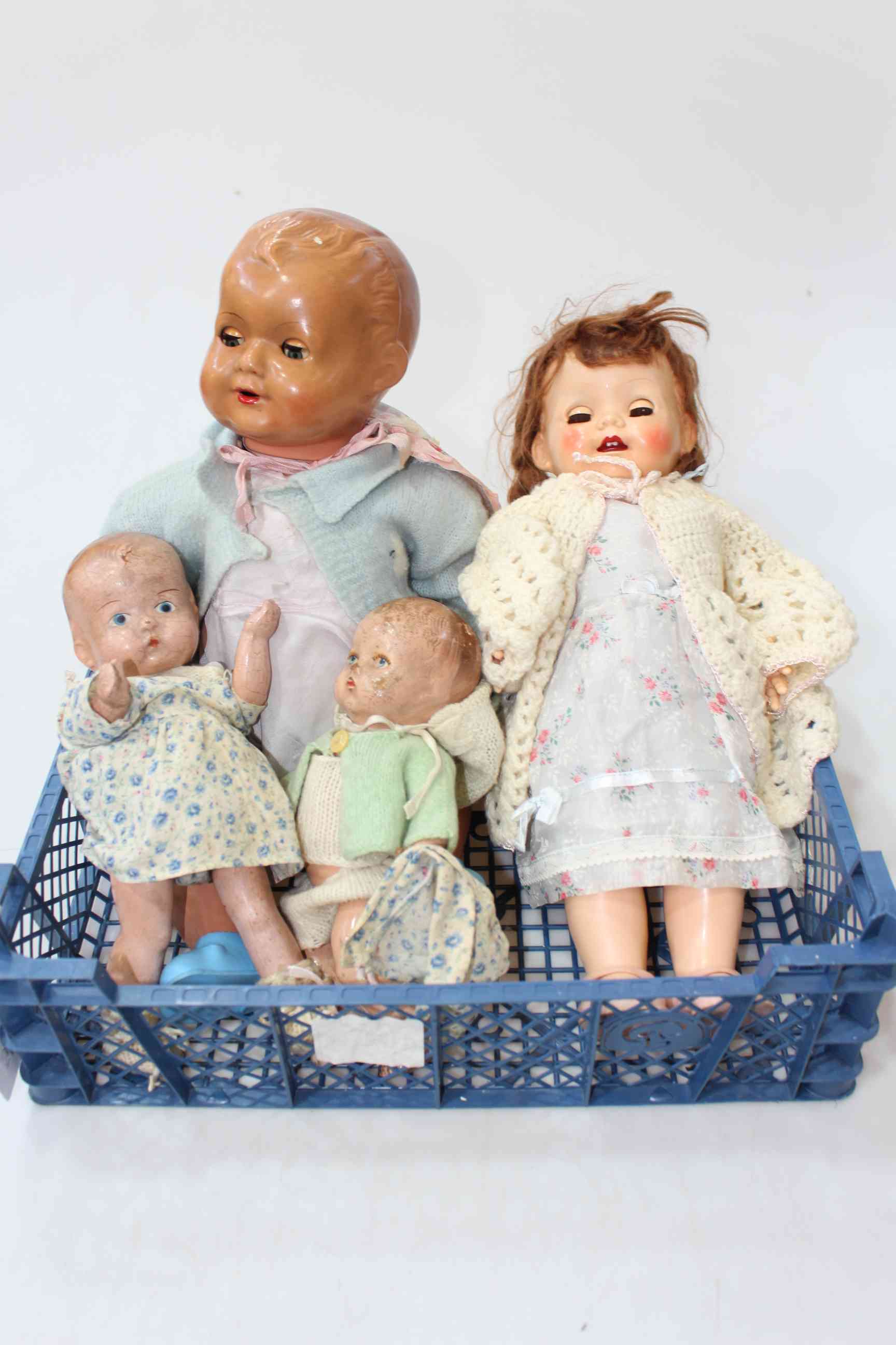 Four vintage dolls including walking and babies.