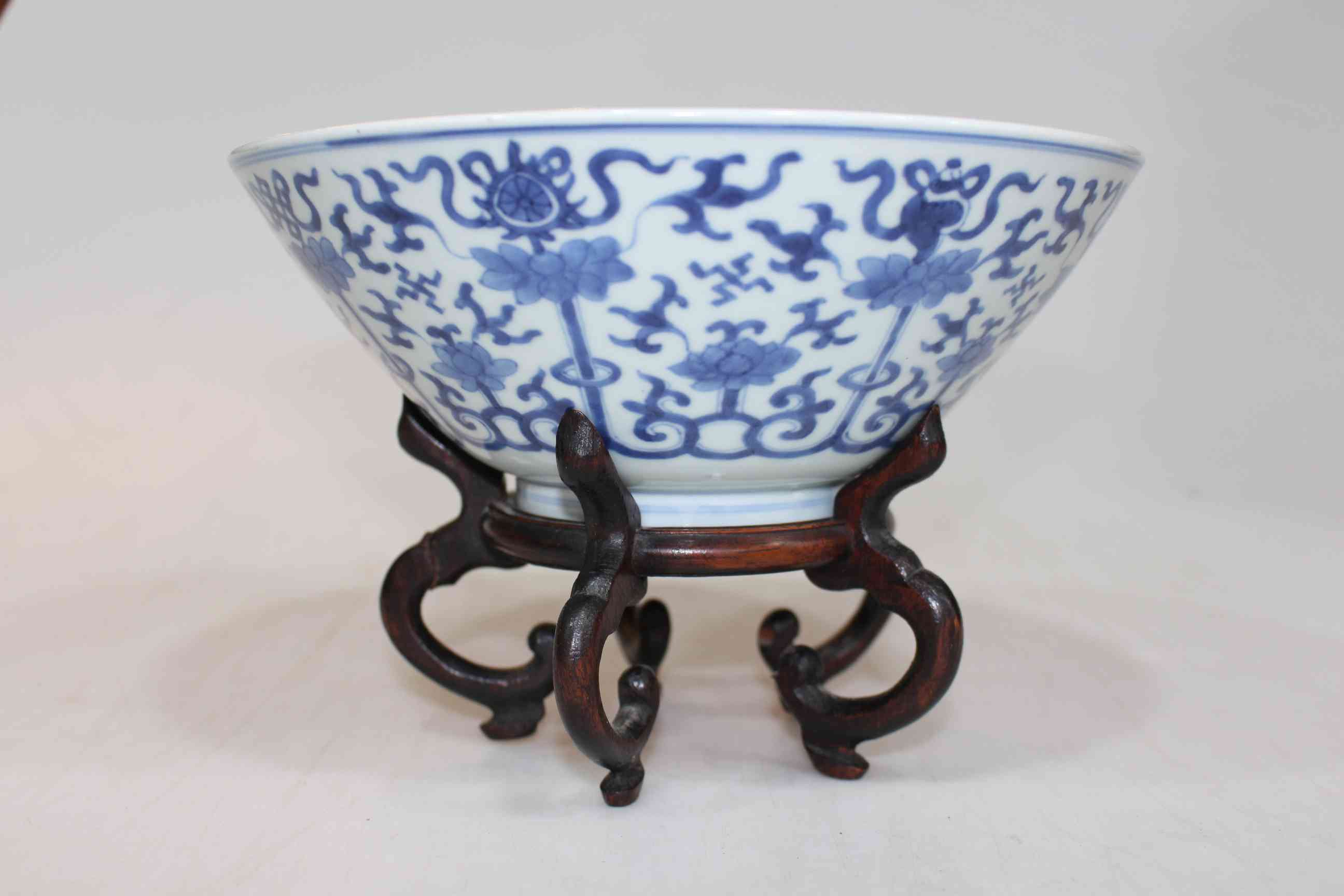 Antique Chinese blue and white bowl with Buddhist emblems, 21.5cm diameter with stand.