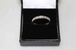 Diamond eternity twenty three stone ring set in white gold or platinum (unmarked), size P.