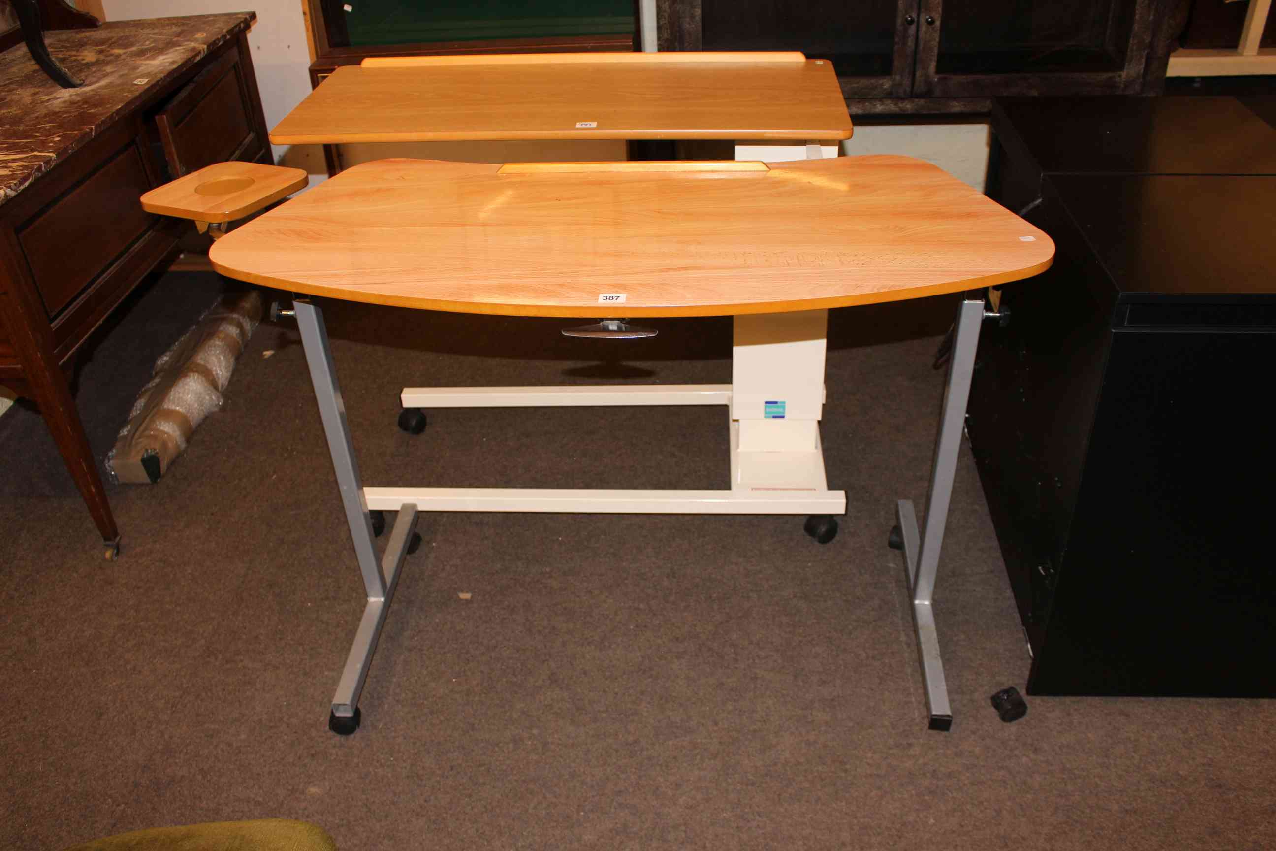 Two portable adjustable serving tables.