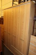 Alstons Furniture beech finish four piece bedroom suite comprising two door combination wardrobe,