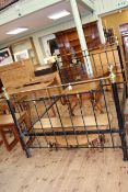 Victorian black and brass double bedstead.