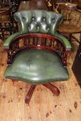 Captains style green leather swivel desk chair.