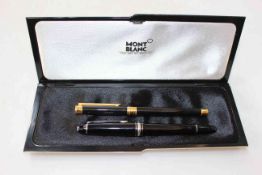Two Mont Blanc pens, Noblesse and Meisterstuck, with two ink bottles.