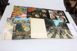 Seven Beatles LP records including Rubber Soul, Sgt.