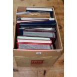 Box containing twelve stamp albums, envelopes, etc.