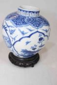 Antique Chinese blue and white 'one hundred butterflies and Pixiu' vase, 13cm, with stand.
