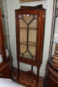 Edwardian mahogany and line inlaid astragal glazed standing corner cabinet, 153.5cm.