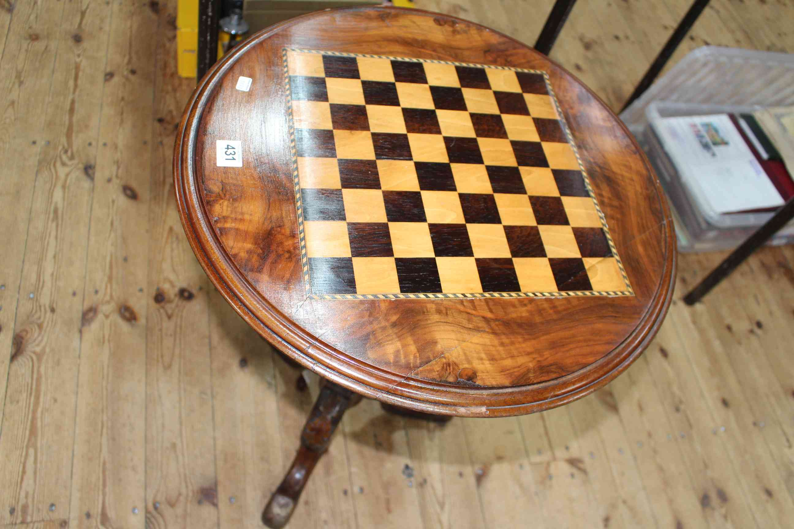 Victorian circular walnut chess top table on pedestal tripod base, 70cm by 52cm diameter.