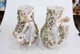 Pair of Continental porcelain maiden, cherub and floral encrusted pierced vases, 37cm high.