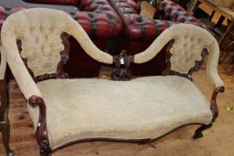 Victorian mahogany double button backed settee with serpentine front seat.