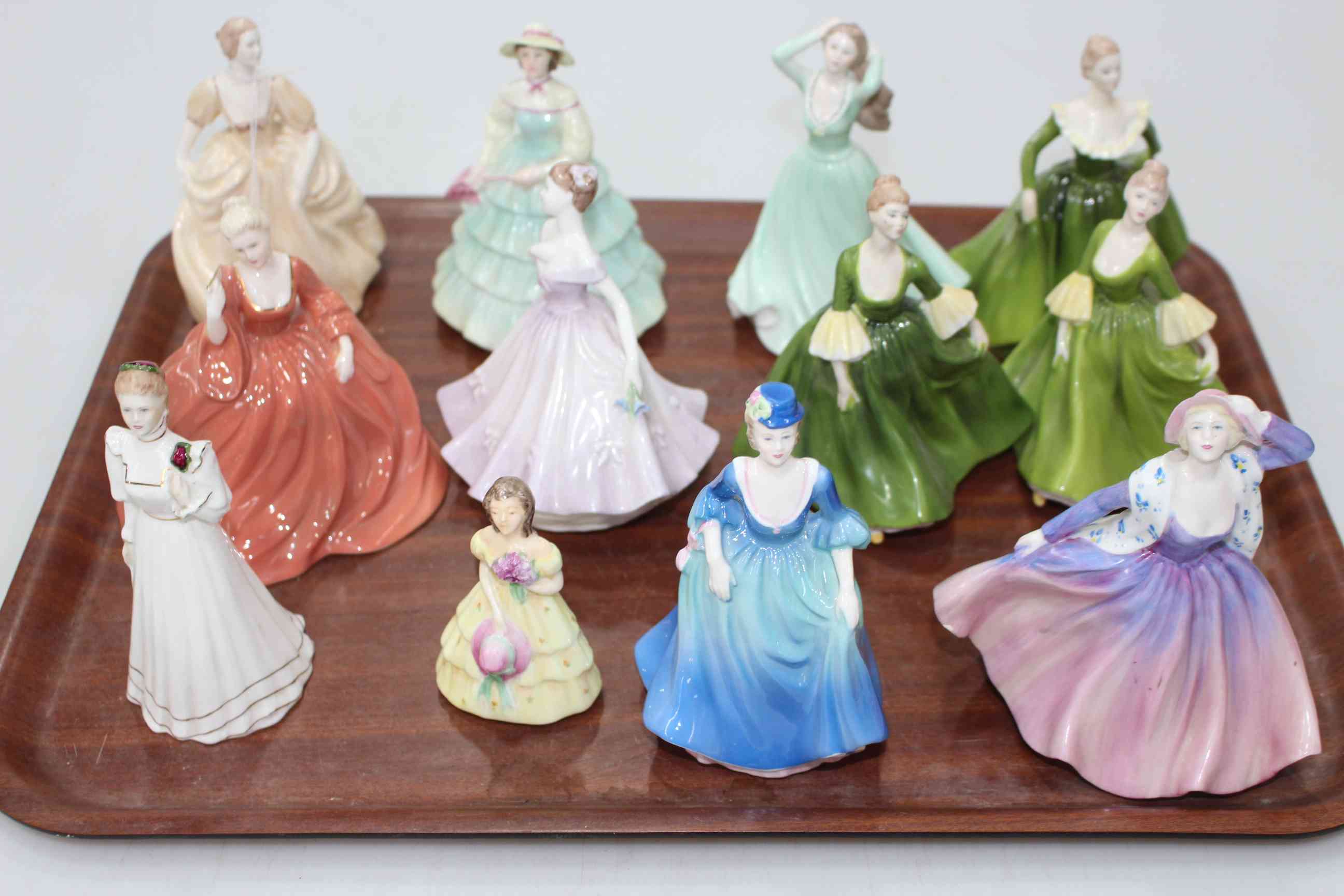 Collection of twelve small Coalport figures including Natalie, Kitty, Shelley, Rosamund, etc.