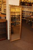 Rectangular gilt framed wall mirror, 153cm by 59cm.