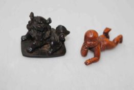 Chinese signed wood figure of baby, 5.5cm across and small Foo dog (2).